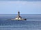 Croatia, Medulin, Nature Park Kamenjak, view of the lighthouse in the middle of the sea