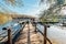 Croatia nature park Plitvice Lakes in autumn. Boy walking on wooden pier on the lake before ferry departure