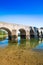 Croatia, river Dobra and old stone bridge in Novigrad