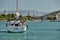 Croatia, Trogir, 20 September 2019: Seaview of sail boat with sailors, cityscape from level of water, tower, cityscape