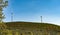 Croatia.Wind turbines standing on a hill against a clear blue sky.