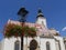 Croatian Church of St. Mark in Zagreb with beautiful red flowers on a Gas Lantern in front