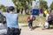 Croatian police officer looking at Refugees passing in front of the EU entrance sign on Serbia-Croatia border crossing of Tovarnik