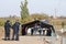 Croatian policeme from the border police waiting for migrants standing on a fence on the Serbia Croatia border on Balkans Route