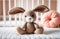 Crochet Beige bunny on child bed. Cute handmade toy. Japanese amigurumi