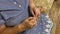 Crochet. Close-up of the hands of an elderly woman knitting