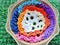 Crochet daisy flowers handmade multicoloured background texture for decoration