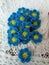 Crochet daisy flowers pattern blue floral white background texture