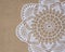 Crochet doily over burlap