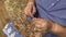 Crochet. Needlework. Close-up of the hands of an elderly woman