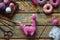 Crochet pink dinosaur. Making toy for child. On table threads, needles, hook, cotton yarn. Handmade crafts. DIY concept. Small
