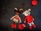 Crochet toys amigurumi. Christmas ladybirds on a dark background