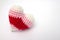 Crochet varicolored heart shape made from yarn isolated on white background.