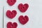 Crocheted amigurumi pink heart with crochet hook and skein of yarn on a white background. Valentine\\\'s day banner