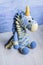 Crocheted unicorn blue of melange threads are yellow elements