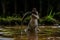 Crocodile feasting on fish in the wetland