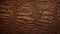 Crocodile skin textured background. Dark brown alligator scales. Concepts of texture, luxury materials, exotic leather