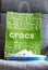 Crocs clogs shoes shopping bag on gray background