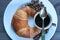 Croissant and coffee for a quick breakfast to begin a successful day