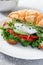 Croissant fish and poached egg sandwich