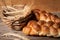 Croissant and fresh pastries on a wooden board