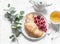 Croissant, fresh raspberries and green tea on a white background, top view. Delicious breakfast, dessert, snack