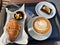 Croissant with Latte and Brownie served with Tray at Cafe Restaurant for Breakfast