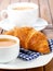 Croissant with marmalade and caffee cup