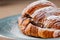 Croissant with nutella and cashews on a plate