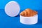 Croissant on white podium on blue