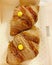 croissants in a box, French croissants with vanilla cream, crispy dough in croissants, breakfast dessert, sweets, confectionery