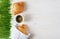 Croissants, coffee and sprouted wheat on a wooden background.