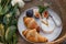 Croissants, figs and camamber cheese in a white ceramic plate