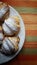 Croissants in a plate on a strips fabric surface