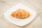Croissants in a white plate/croissants in a white square plate o