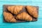 Croissants on wooden background