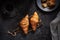 Croissants on a wooden cutting board