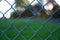 Crooked line pattern of chain link fence