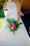 Crop bride with bouquet and groom