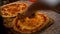 Crop chef slicing Margherita pizza in kitchen