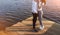 Crop couple hugging on pier