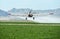 Crop duster over alfalfa in the Mohave Valley