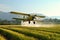 Crop Duster plane spraying crops.