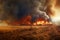 Crop fields being destroyed by a wildfire, the horizon glowing with flames against dramatic sky filled with clouds of dark smoke.