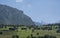 Crop fields and pastures in the surroundings of the village of Las Arenas de Cabrales, Asturias, Spain, with the Naranjo de Bulnes