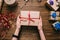 Crop hands holding wrapped present on table