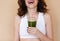 Crop happy woman with healthy drink