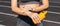 Crop image of a woman protecting her hands and arms with sunblock before training at the stadium on a sunny day. Skincare concept