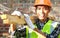 Crop images of man worker carrying wood smiling