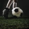 Crop legs kicking ball grass. High quality and resolution beautiful photo concept